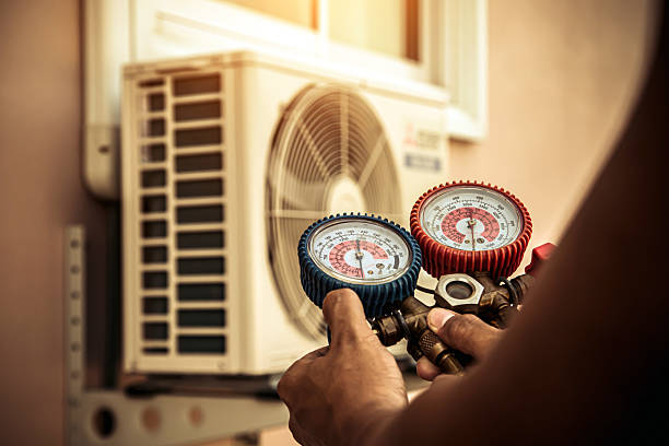 Professional Air Conditioning Service technician working in Jacksonville, AL
